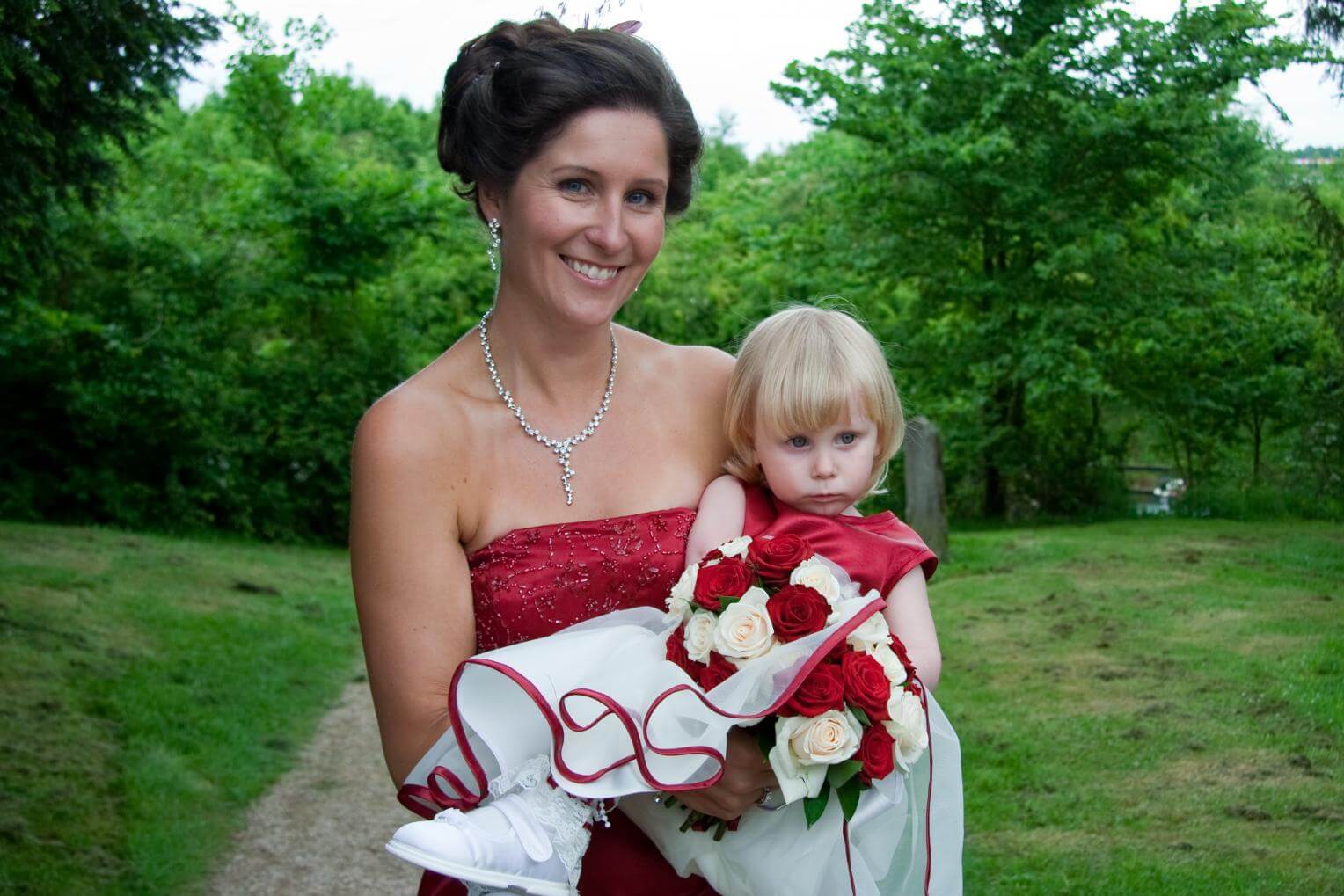 bridesmaid carrying child bridesmaid